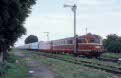 CFR 78 1017 + 78 1019 trail passenger train P 3113 (Timisoara Nord, RO - Oradea, RO) behind CFR 60 1192 and 7 CFR coaches at Zimandu Nou (RO) on 11 June 2002