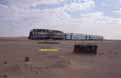 SNIM CC04 + ex-FNM doubledeck motorcar + ex-NMBS I3 coach between Choum and Touajil (Mauritania) on 22 December 2001