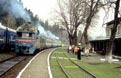UZ D1 628 + 658 (from left to right) as Rakhiv (UA) - Iv. Frankovsk (UA) passenger train departs at Mikulichin (UA) on 18 April 2005.
