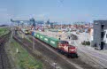 From left to right at Rotterdam Waalhaven RSC container terminal on 13 August 2002: Railion Benelux 6421 + ERS container train 42501 (Rotterdam Maasvlakte, NL - Prague Zizkov, CZ); HGK DE 81 in use by ShortLines with RDP container train 60121 (Rotterdam Maasvlakte, NL - Acht, NL)