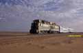 SNIM CC04 + ex-FNM doubledeck motorcar + ex-NMBS I3 coach between Choum and Touajil (Mauritania) on 22 December 2001