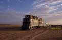 SNIM CC04 + ex-FNM doubledeck motorcar + ex-NMBS I3 coach at Touajil (Mauritania) on 22 December 2001